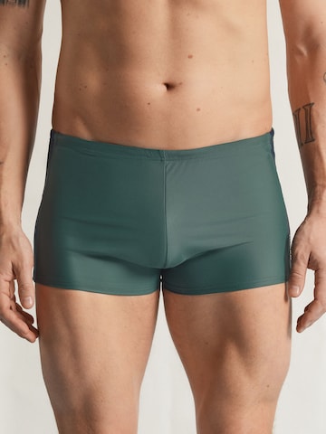 IUMAN Intimissimi Swim Trunks in Green: front