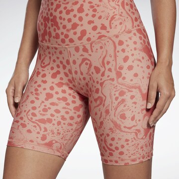 Skinny Pantaloni sportivi di Reebok in rosso