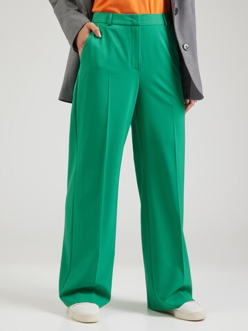 COMMA Loose fit Trousers with creases in Green: front