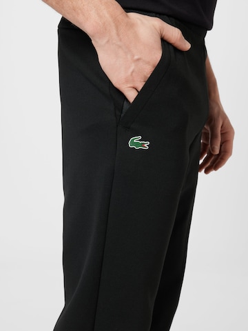 Effilé Pantalon de sport Lacoste Sport en noir