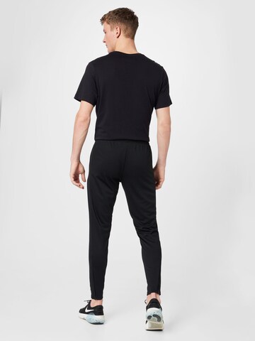 Coupe slim Pantalon de sport 'Academy 23' NIKE en noir