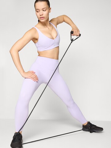 Fabletics Skinny Urheiluhousut 'PURELUXE' värissä lila