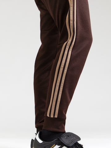 Tapered Pantaloni 'SST' de la ADIDAS ORIGINALS pe maro