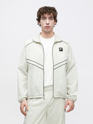 Nike Sportswear Prehodna jakna 'AIR' | bež barva