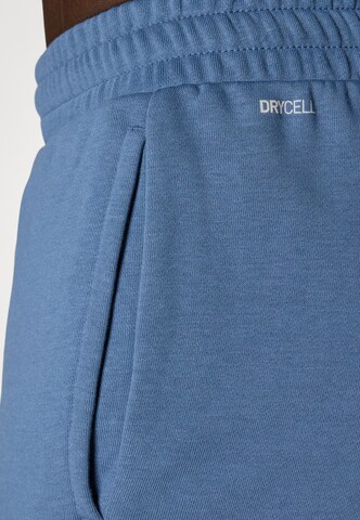 PUMA Regular Workout Pants 'TAD Essentials' in Blue