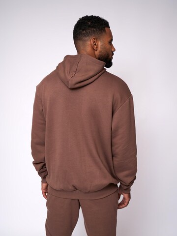 Pullover 'Essential Oversized Hoodie' di Fortex Fitness in marrone