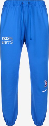 Effilé Pantalon de sport NIKE en bleu : devant