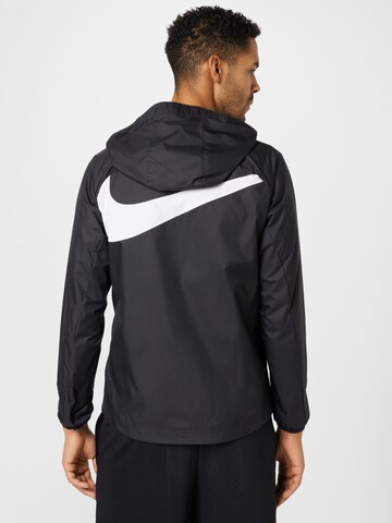 Geacă de primăvară-toamnă de la Nike Sportswear pe negru