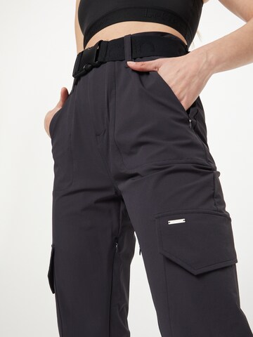 Tapered Pantaloni sportivi di aim'n in nero