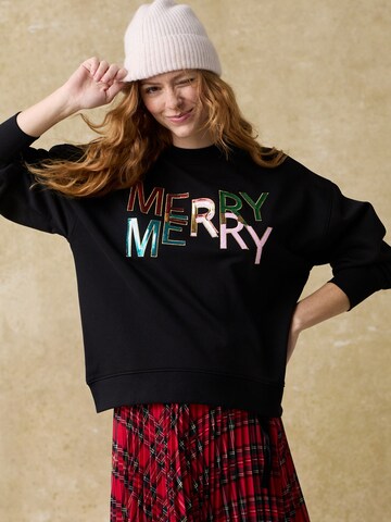 Next Sweatshirt 'Merry Merry' in Schwarz