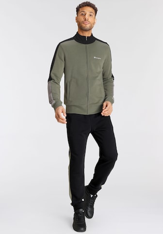 Champion Authentic Athletic Apparel Tracksuit in Green: front