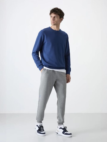 Tommy Life - Skinny Calças de desporto 'Jogginghose' em cinzento