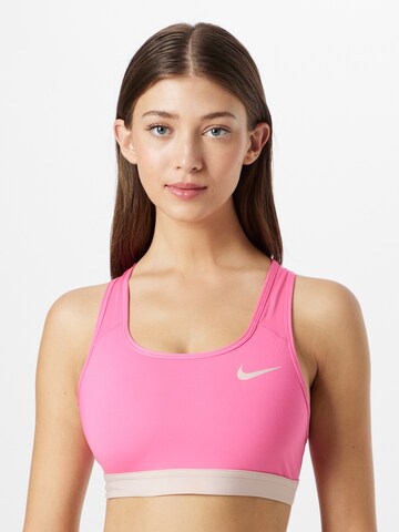 NIKE Regular Sports bra in Pink: front