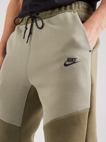 Nike Sportswear Tapered Παντελόνι 'TCH FLC' σε πράσινο