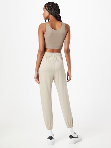 Onzie Tapered Workout Pants in Beige
