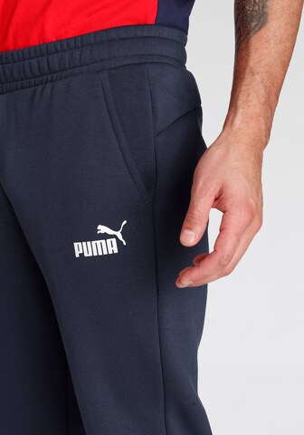 PUMA Tapered Sportbroek in Blauw