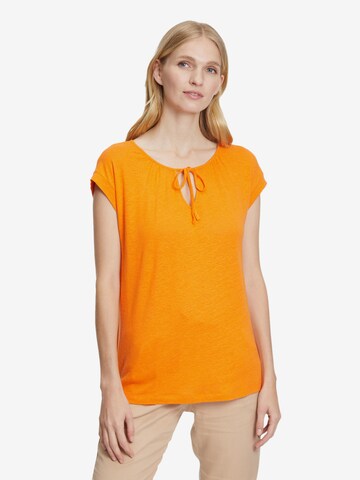 T-shirt Cartoon en orange : devant