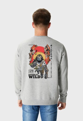 Oldskull Sweatshirt 'Wrldvibe Return to Wild Graphic' in Grau