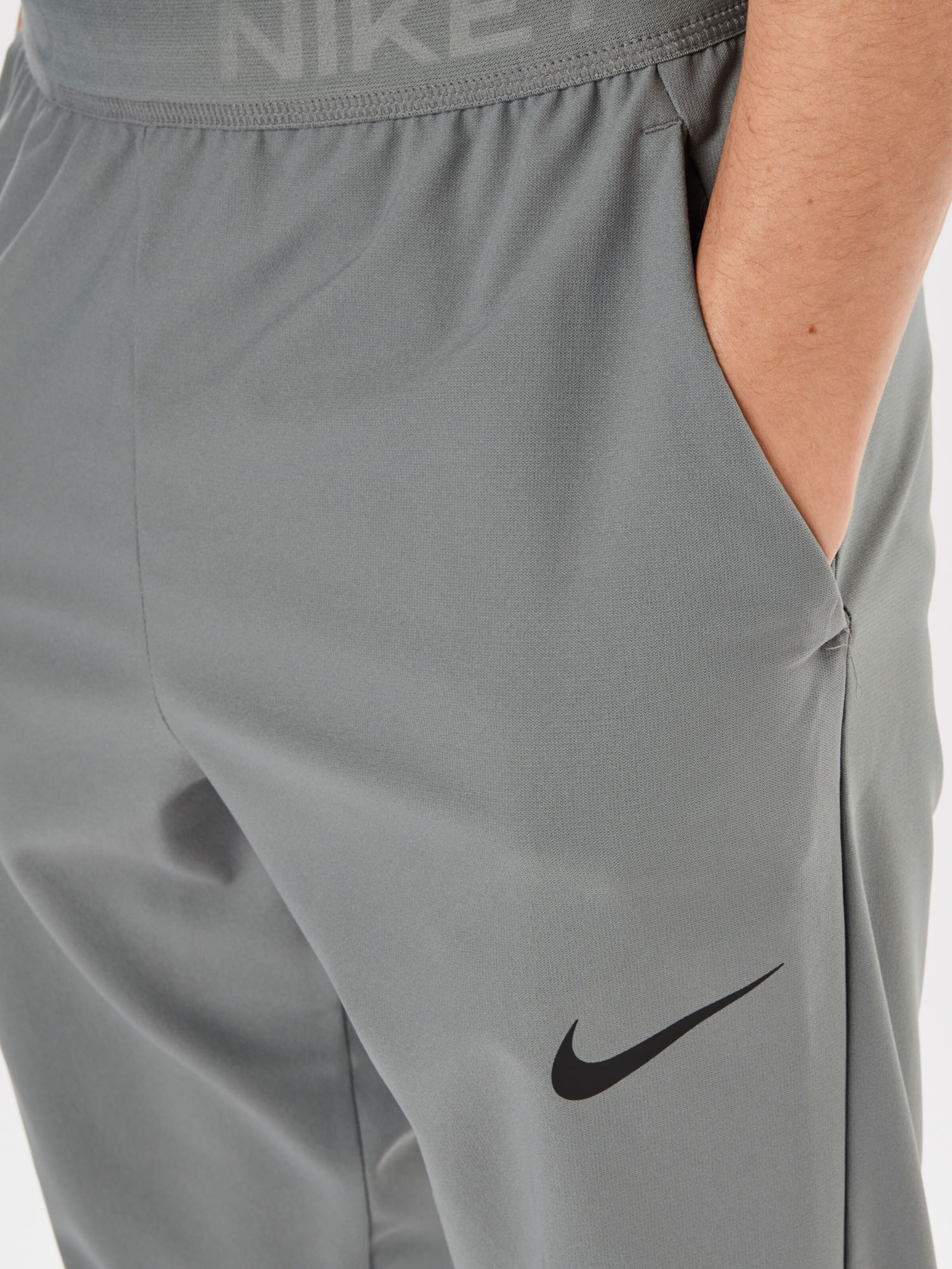 NIKE Pantaloni sportivi in Grigio Scuro | ABOUT YOU