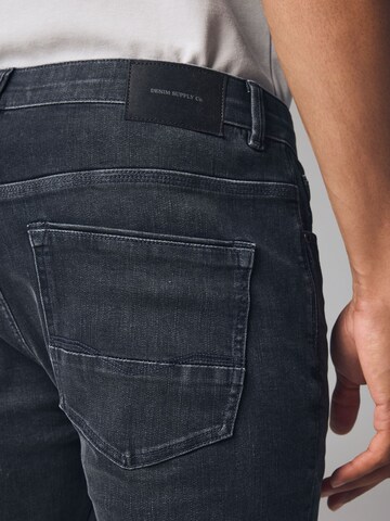 Next Slimfit Jeans i grå