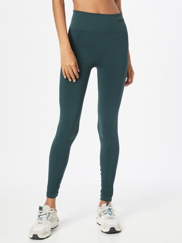 Skinny Pantalon de sport Hummel en vert : devant