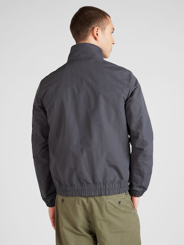 Tommy Jeans Prehodna jakna 'ESSENTIAL' | siva barva