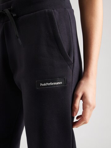 Effilé Pantalon de sport PEAK PERFORMANCE en noir