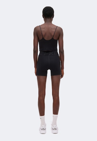 NIKE Skinny Spodnie sportowe 'NP' w kolorze czarny