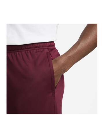 NIKE Regular Sports trousers in Red