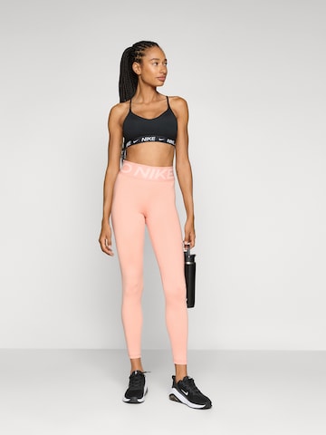 oranžinė NIKE Siauras Sportinės kelnės