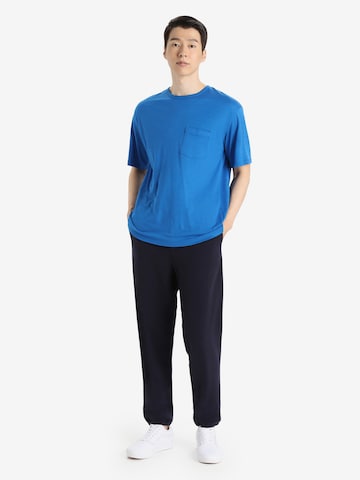 ICEBREAKER Toiminnallinen paita 'Granary' värissä sininen