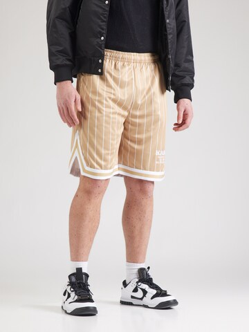 Karl Kani Loose fit Trousers in Beige: front