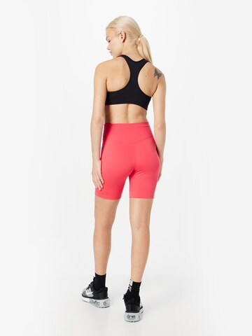 NIKE Skinny Športne hlače | rdeča barva