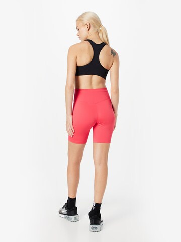 NIKE - Skinny Calças de desporto em vermelho