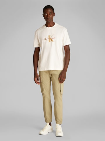 Calvin Klein Jeans Koszulka w kolorze beżowy