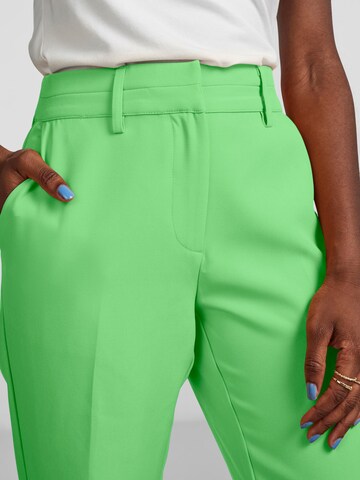 Flared Pantaloni con piega frontale 'BLURIS' di Y.A.S in verde