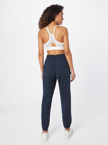 Effilé Pantalon de sport 'RESET' Girlfriend Collective en bleu