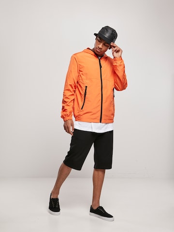 Veste mi-saison Urban Classics en orange