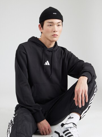 ADIDAS SPORTSWEAR Sportsweatshirt 'Essentials Feelcozy' i sort: forside