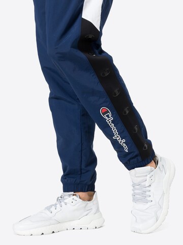 Effilé Pantalon de sport Champion Authentic Athletic Apparel en bleu