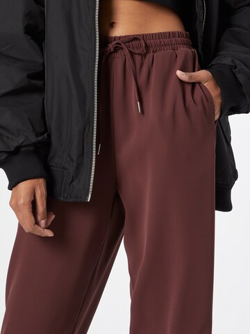 ABOUT YOU Loose fit Trousers 'Romina' in Brown