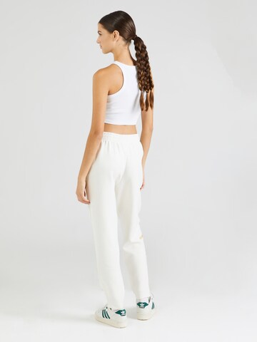 Tapered Pantaloni sportivi di HOKA in bianco