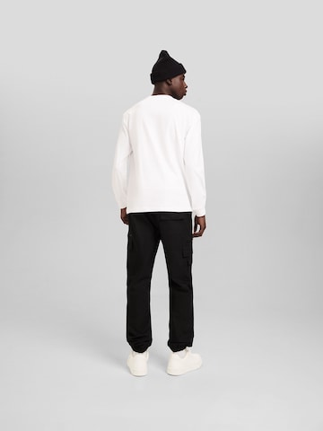 Bershka Tapered Cargo Pants in Black