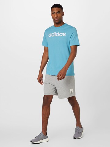 ADIDAS SPORTSWEAR Λειτουργικό μπλουζάκι 'Essentials Linear Embroidered Logo' σε μπλε