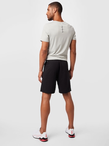 PUMA Regular Sportshorts 'TeamRise' in Schwarz