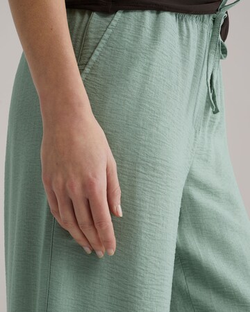 žalia WE Fashion Plačios klešnės Kelnės