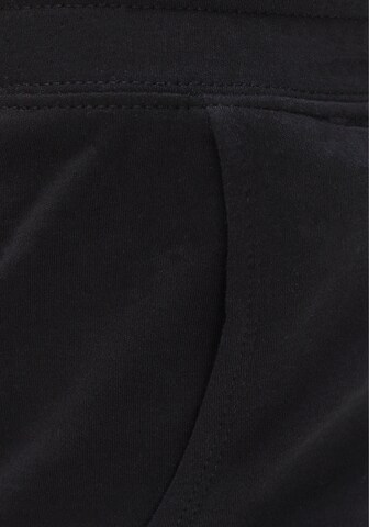 FLASHLIGHTS Loosefit Hose in Schwarz