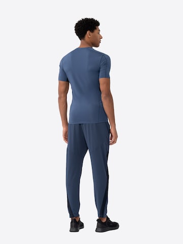 4F Slimfit Funkční kalhoty – modrá