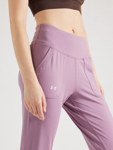 Effilé Pantalon de sport 'Motion' UNDER ARMOUR en violet