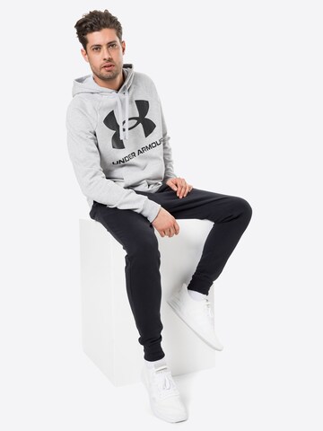 UNDER ARMOUR - Sweatshirt de desporto em cinzento